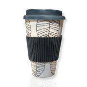 Studio image of the Bamboo Coffee Cup shown upright with lid and silicone grip, highlighting its minimalist design and natural texture in a clean, neutral setting