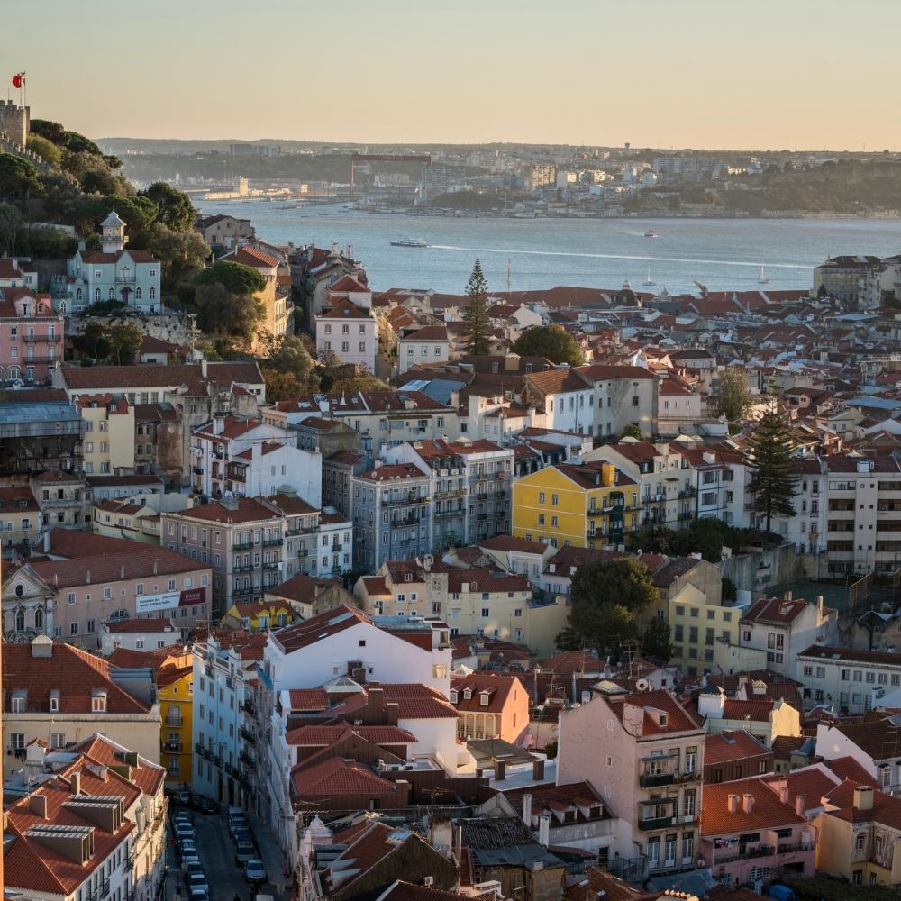 Stock image of Lisbon showcasing colorful architecture, tiled facades, and hillside views, capturing the city’s vibrant charm and cultural vibrancy—ideal for contextual storytelling or collection backdrop use