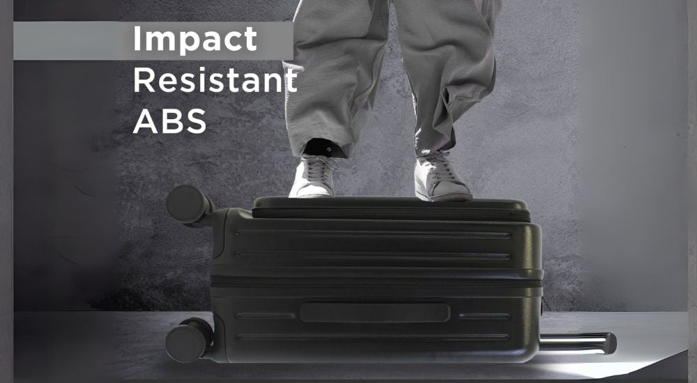 Studio feature image of the Seattle Impact carry-on in black, highlighting its sleek silhouette and eco-conscious hard-shell design