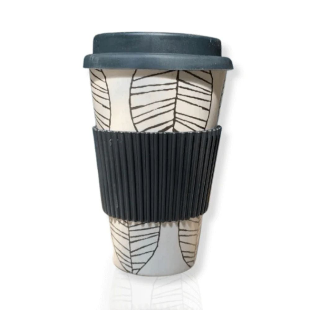 Studio image of the Bamboo Coffee Cup shown upright with lid and silicone grip, highlighting its minimalist design and natural texture in a clean, neutral setting
