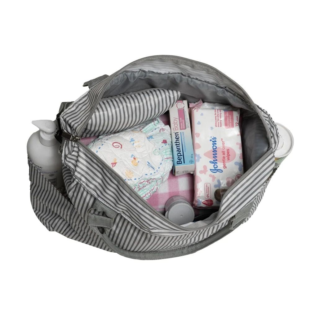 Striped eco-friendly diaper bag with baby essentials packed inside – studio product image 01